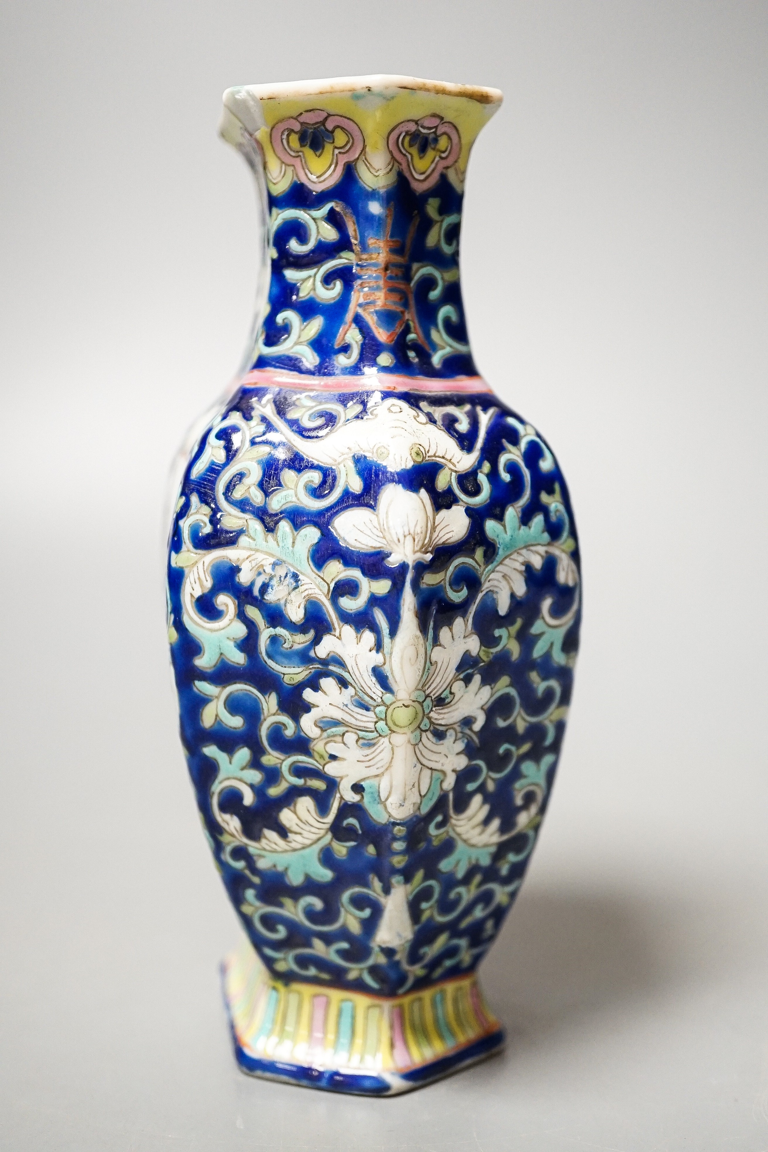 A Chinese blue ground famille rose hexagonal vase, late 19th century, 15cm